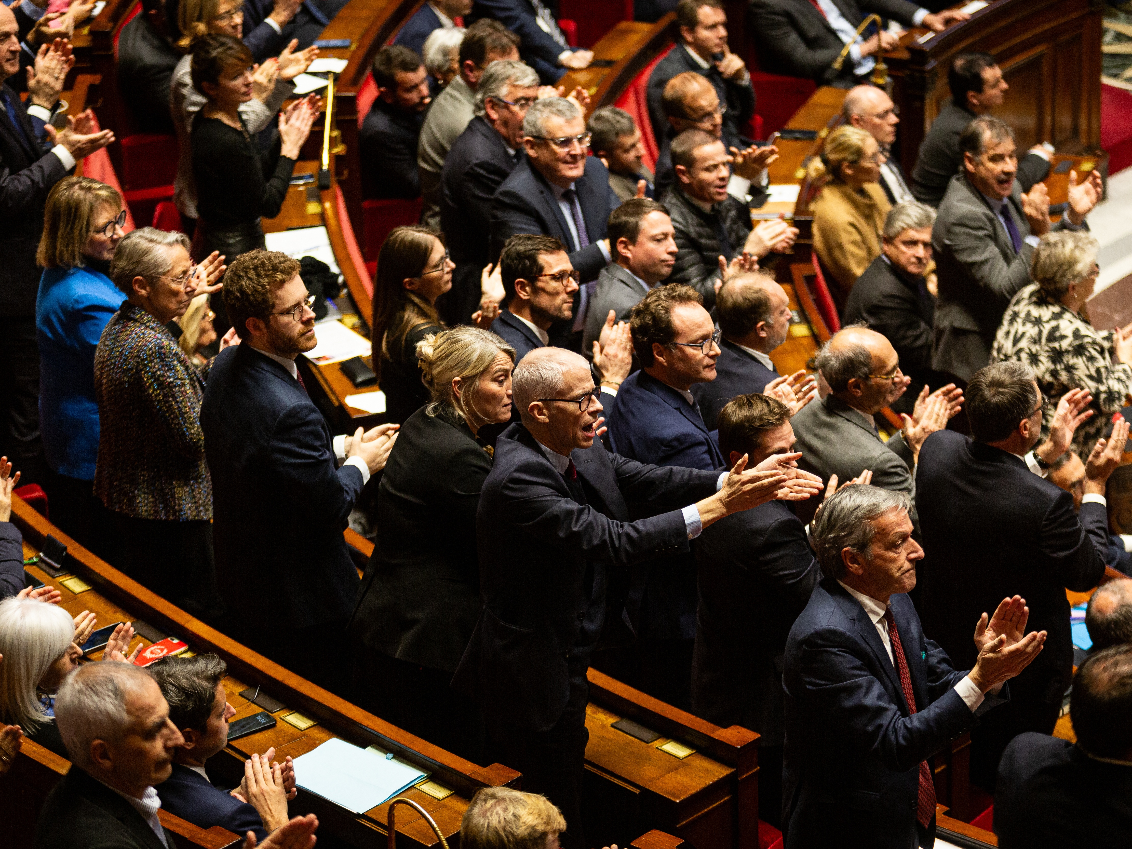 caption: French lawmakers debate in the National Assembly in Paris Wednesday. A majority of legislators voted to oust Prime Minister Michel Barnier, forcing him to resign.