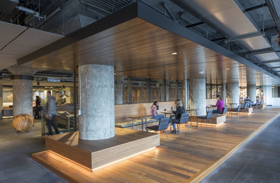 caption: Starbucks will trade some dedicated desks for collaborative workspaces that look more like a coffee shop during its year-long redesign of its SODO headquarters