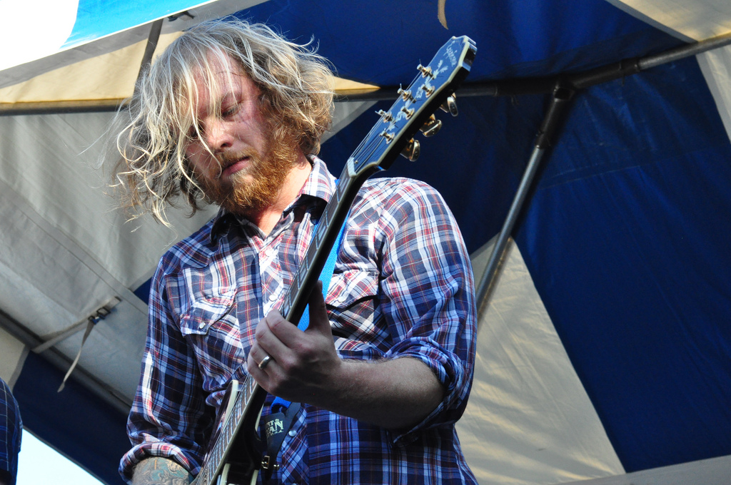 caption: Jesse Bonn, guitarist for the Maldives, performs with the band at the 2010 Ballard Seafood Fest.