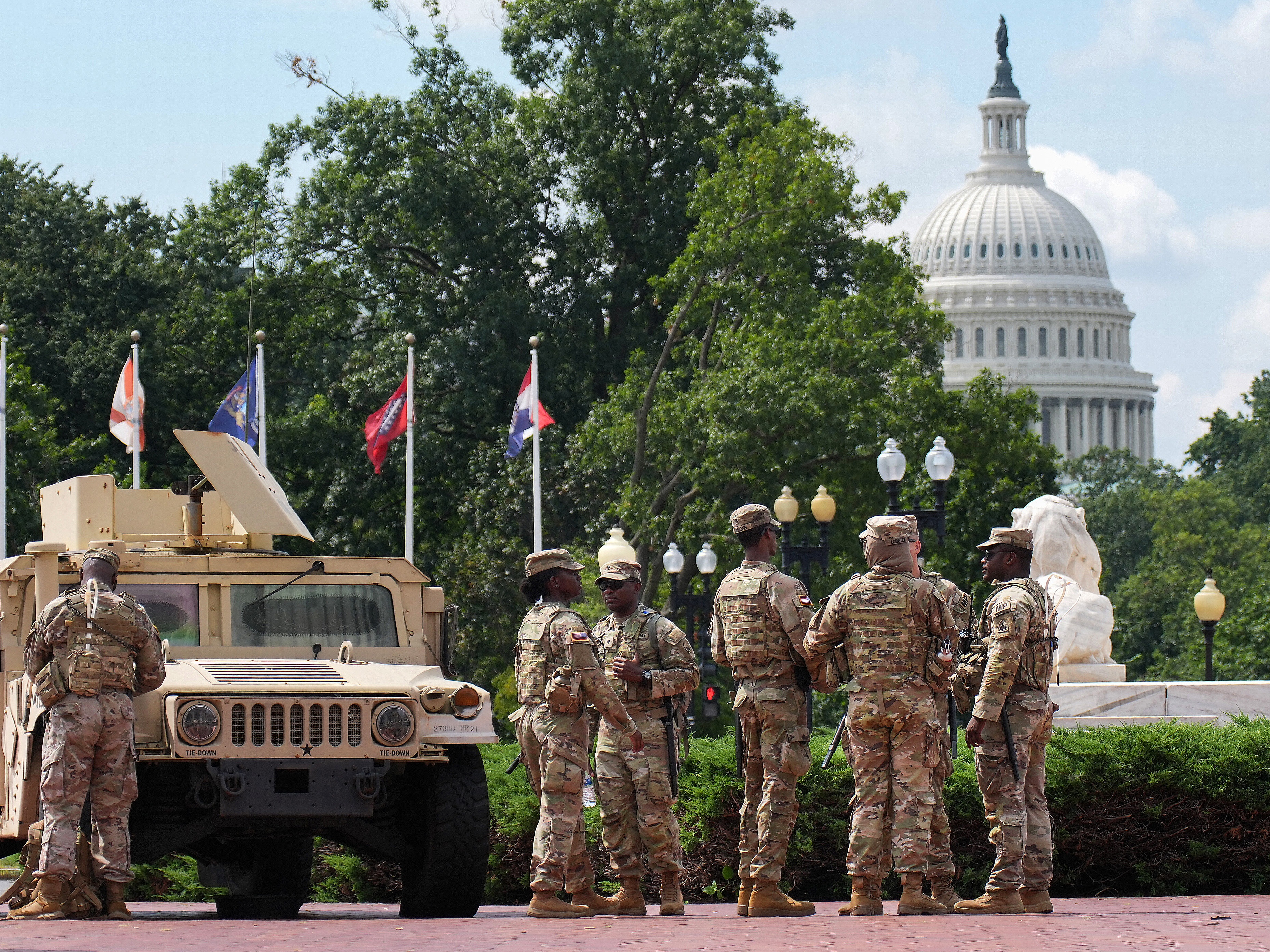 caption: Members of the National Guard stand by at Union Station on August 14, 2025 in Washington, DC.