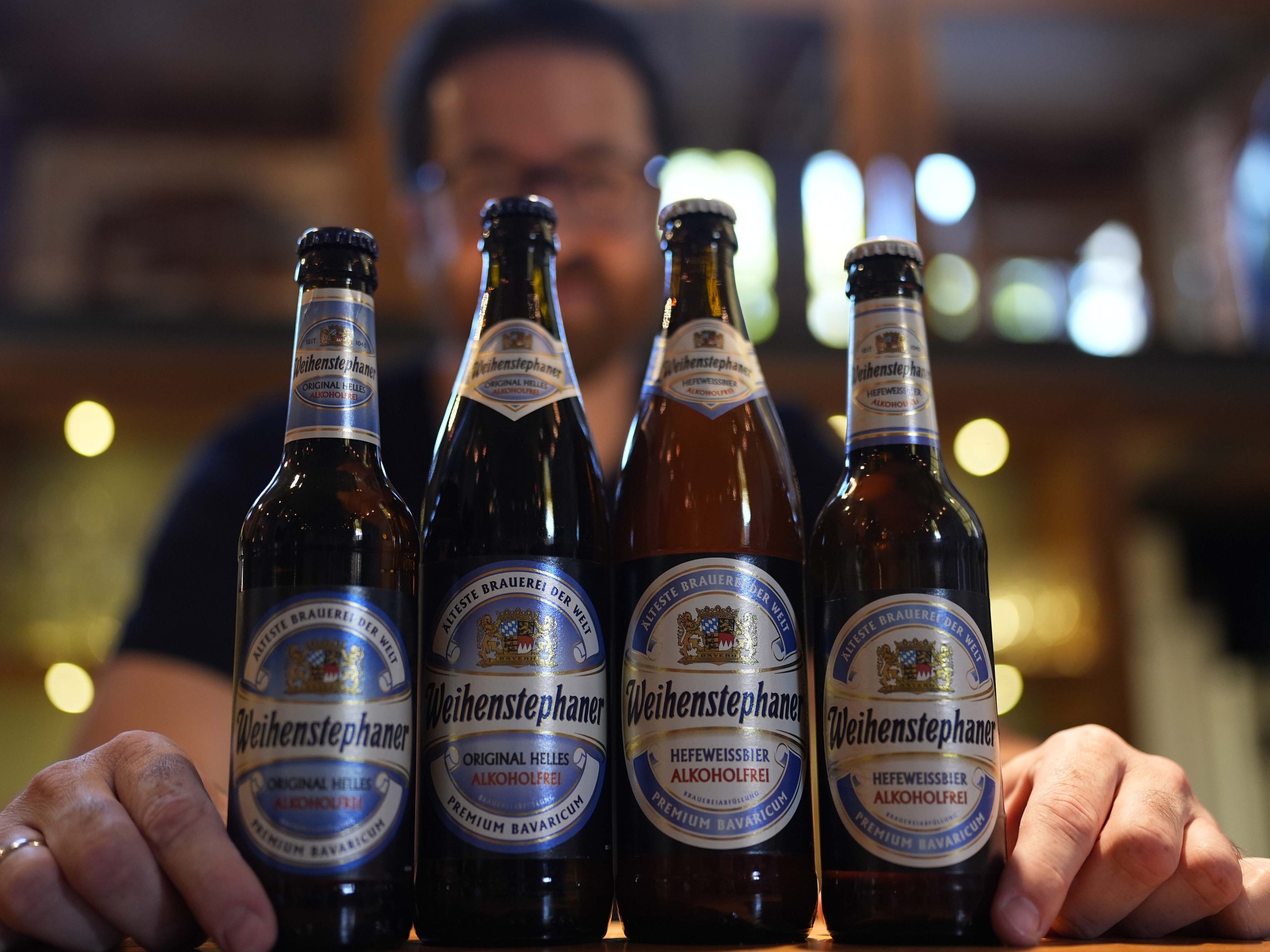caption: Head Brewmaster Tobias Zollo poses behind non alcoholic beer at the Weihenstephan brewery in Freising, Germany, Friday, Sept. 20, 2024.