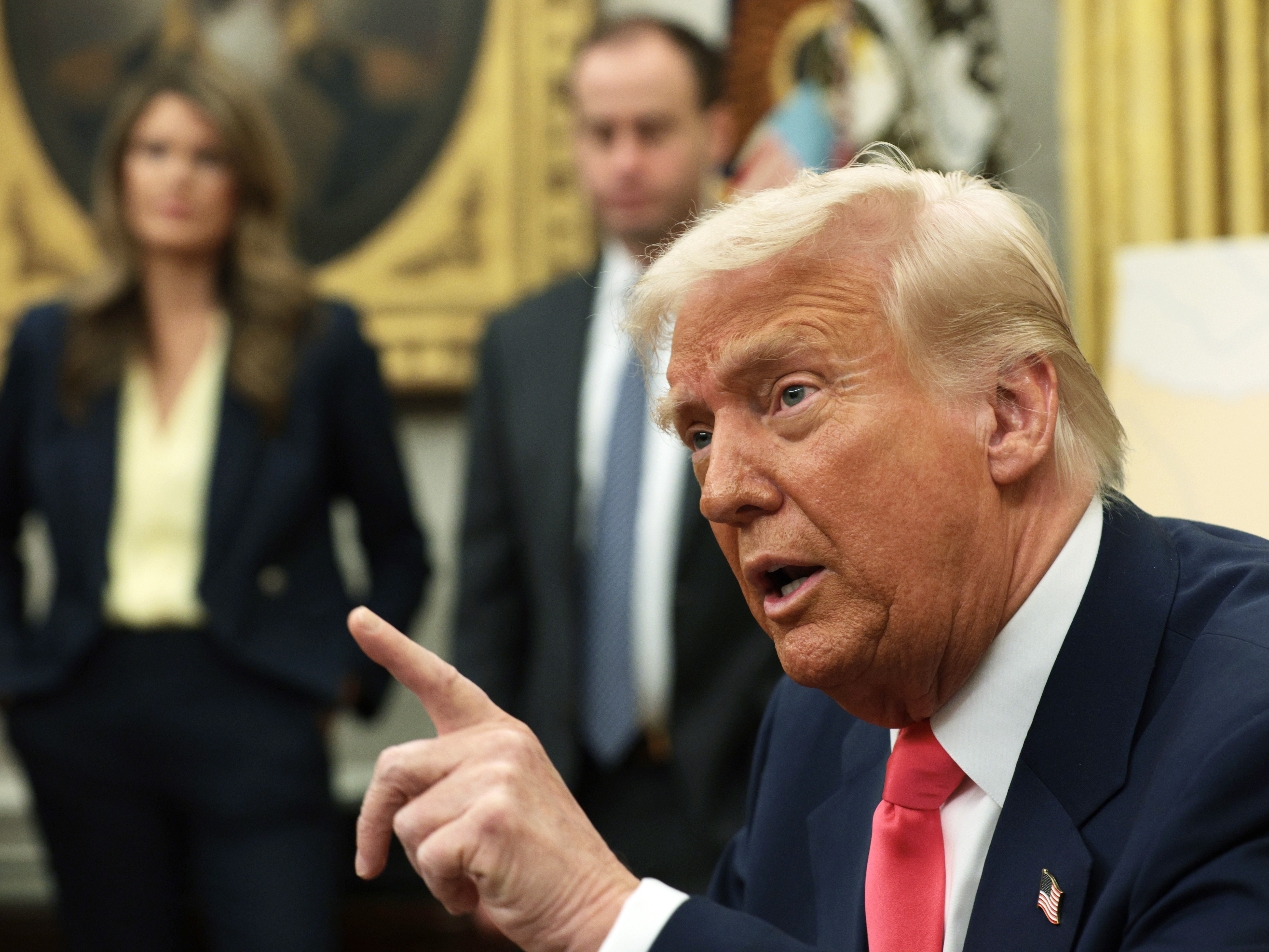 caption: President Trump speaks after signing executive orders in the Oval Office of the White House on March 6, including one to lift 25% tariffs for all goods compliant under USMCA trade agreement.
