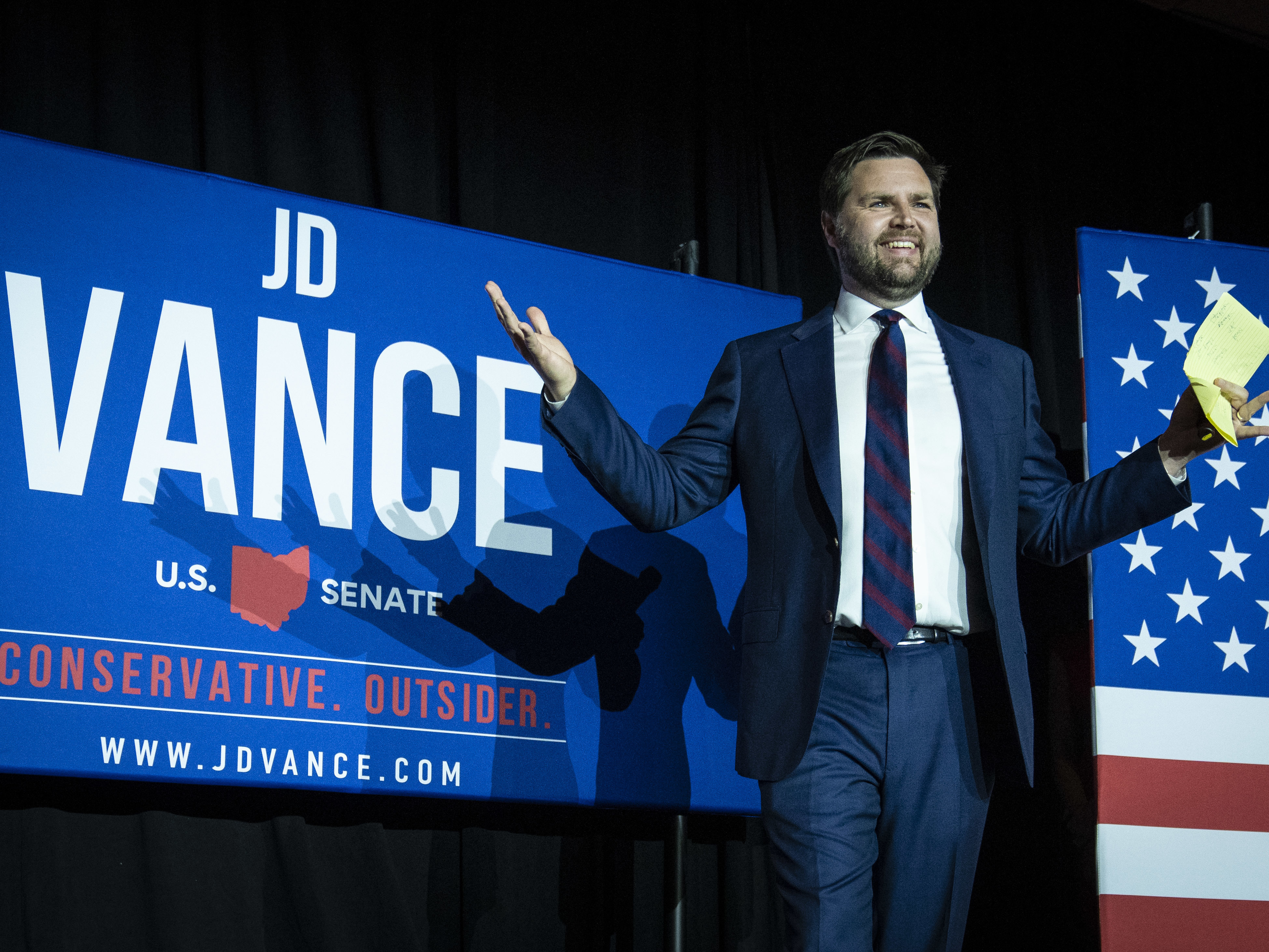 caption: Ohio Republican U.S. Senate candidate J.D. Vance arrives onstage in Cincinnati after winning the primary Tuesday night.