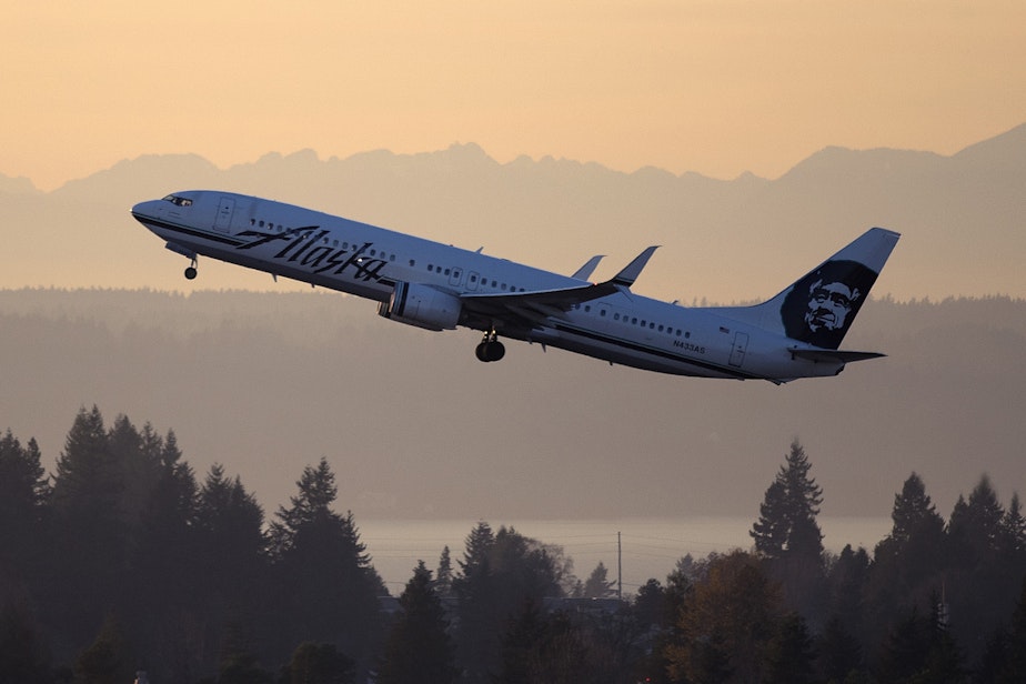 caption: An Alaska Airlines jet takes off from Sea-Tac International Airport 