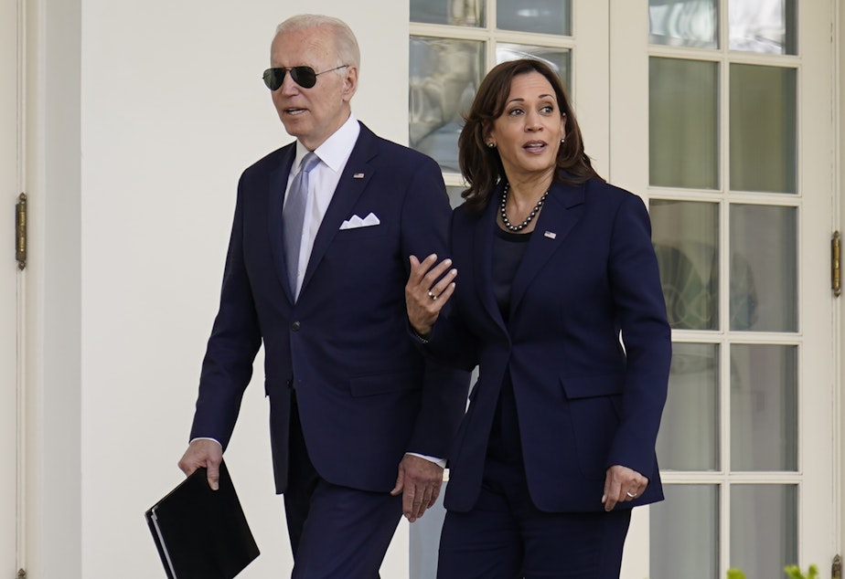 caption: President Joe Biden and Vice President Kamala Harris walk to the Oval Office after an event in the Rose Garden on April 11, 2022.