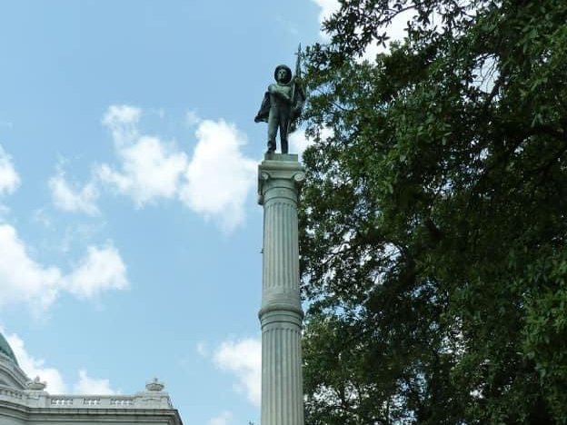 caption: The controversial South's Defenders Memorial Monument has stood at the Calcasieu Parish Courthouse in Lake Charles, La., for more than 100 years. But Hurricane Laura has toppled the soldier.