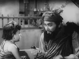 caption: A still from the 1961 Hindi film <em>Kabuliwala</em>,<em> </em>directed by Hemen Gupta.