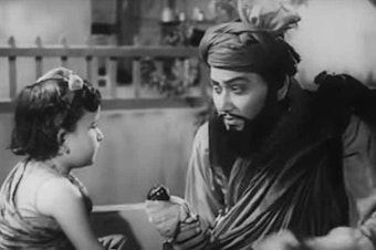 caption: A still from the 1961 Hindi film <em>Kabuliwala</em>,<em> </em>directed by Hemen Gupta.