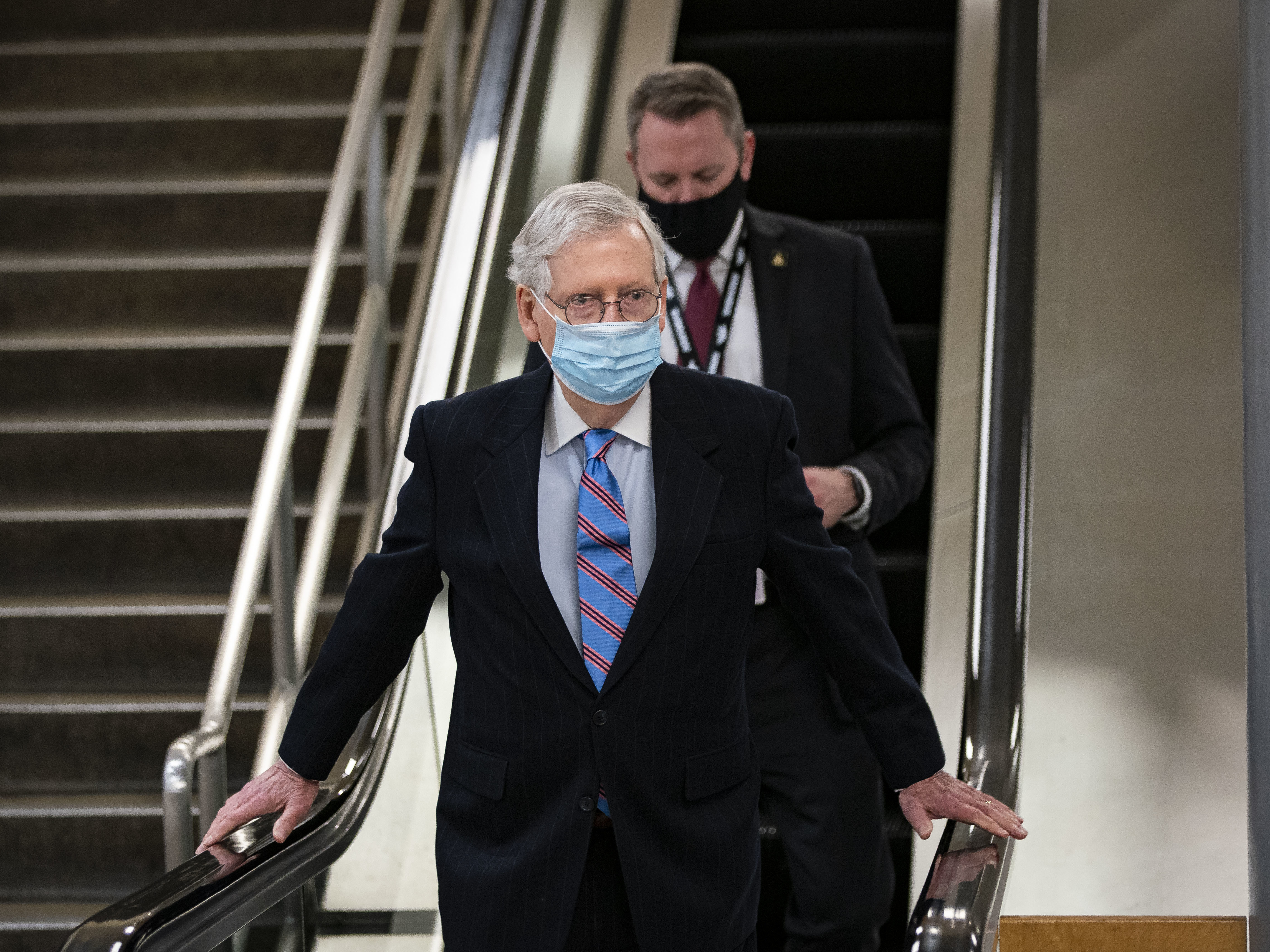 caption: Senate Minority Leader Mitch McConnell, seen here on Feb. 23, has called House Speaker Nancy Pelosi's proposal for a commission to study the events of Jan. 6 "a "bizarre, partisan concept."