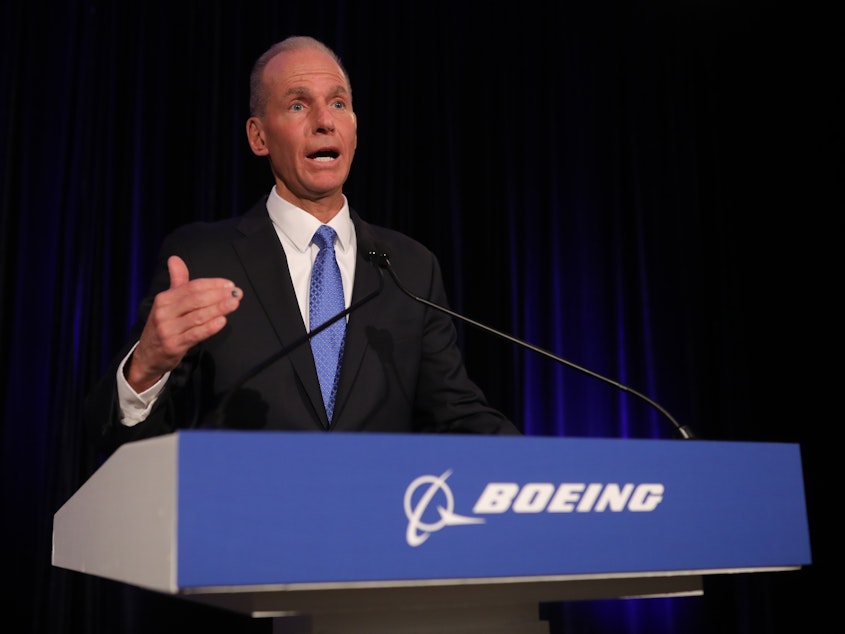 caption: Boeing Chief Executive Officer Dennis Muilenburg speaks at the Boeing Annual Shareholders Meeting on Friday in Chicago.