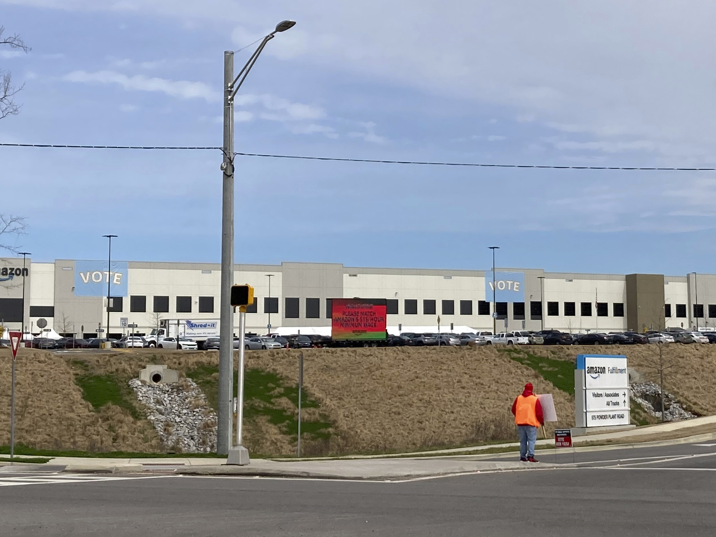 caption: Some 5,800 workers at Amazon's facility in Bessemer, Ala., held a historic vote on whether to form the company's first warehouse union.