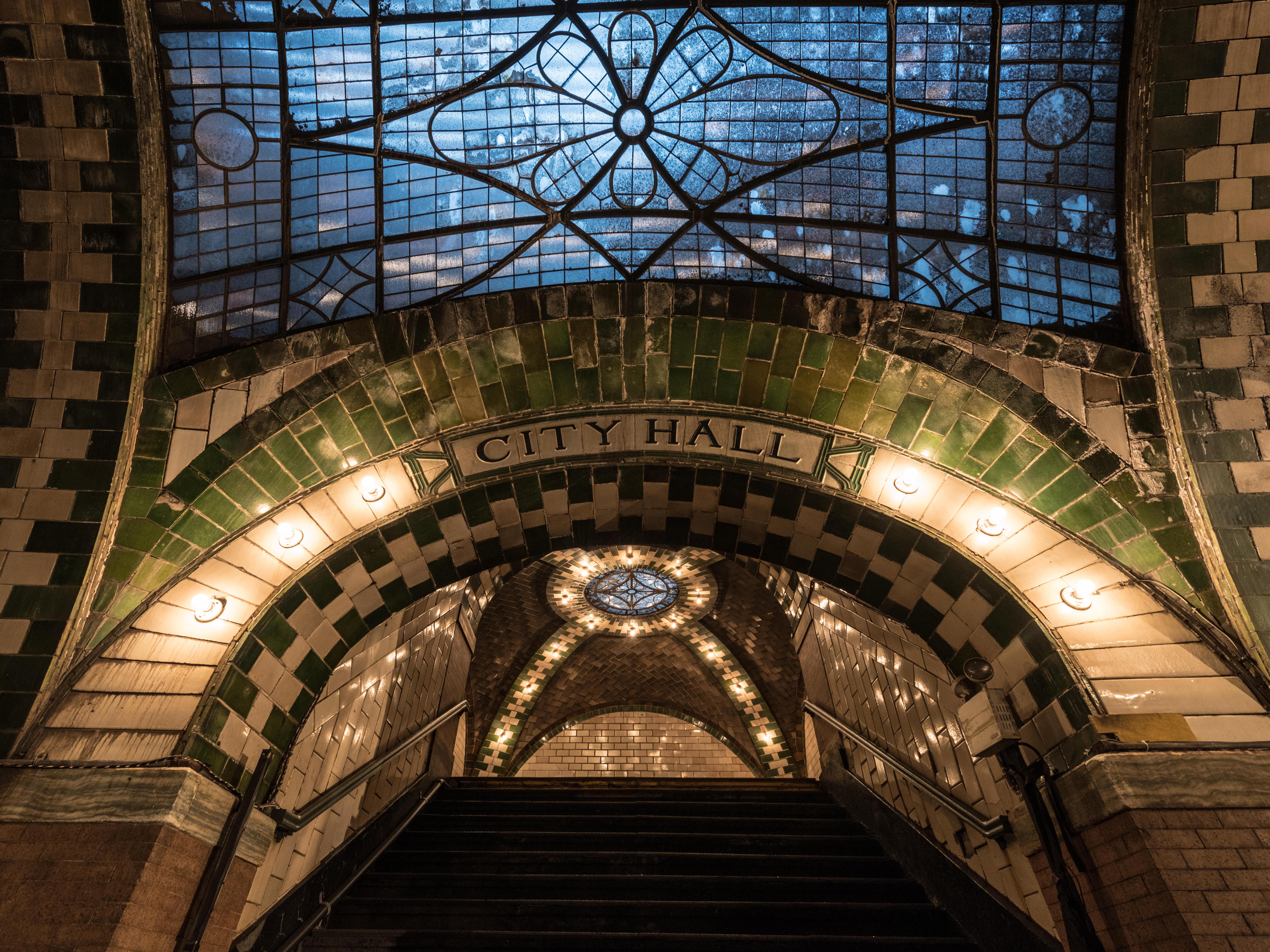 caption: New York City's incoming mayor Zohran Mamdani picked the decommissioned subway station under City Hall as the site of his private swearing-in ceremony.