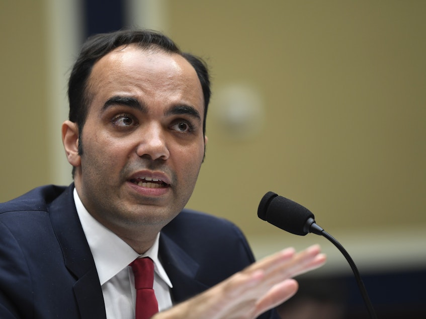 caption: Rohit Chopra, Biden's pick to run the Consumer Financial Protection Bureau, told lawmakers at a remote hearing, "the financial lives of millions of Americans are in ruin." He's pictured here at a hearing in 2019.
