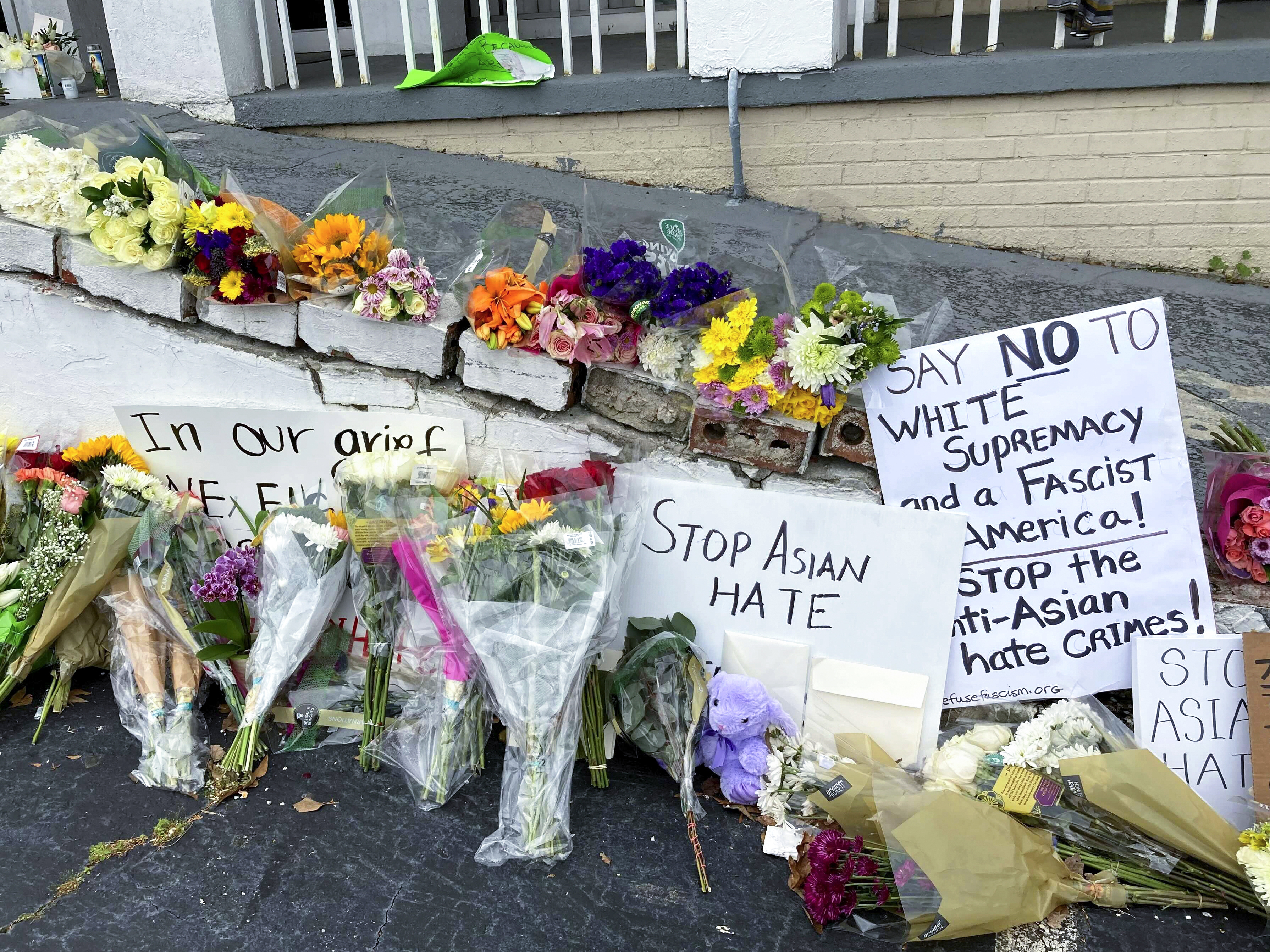 caption: A makeshift memorial is seen on Friday in Atlanta, following the mass shooting of eight people, six of whom were of Asian descent, at three different massage parlors.