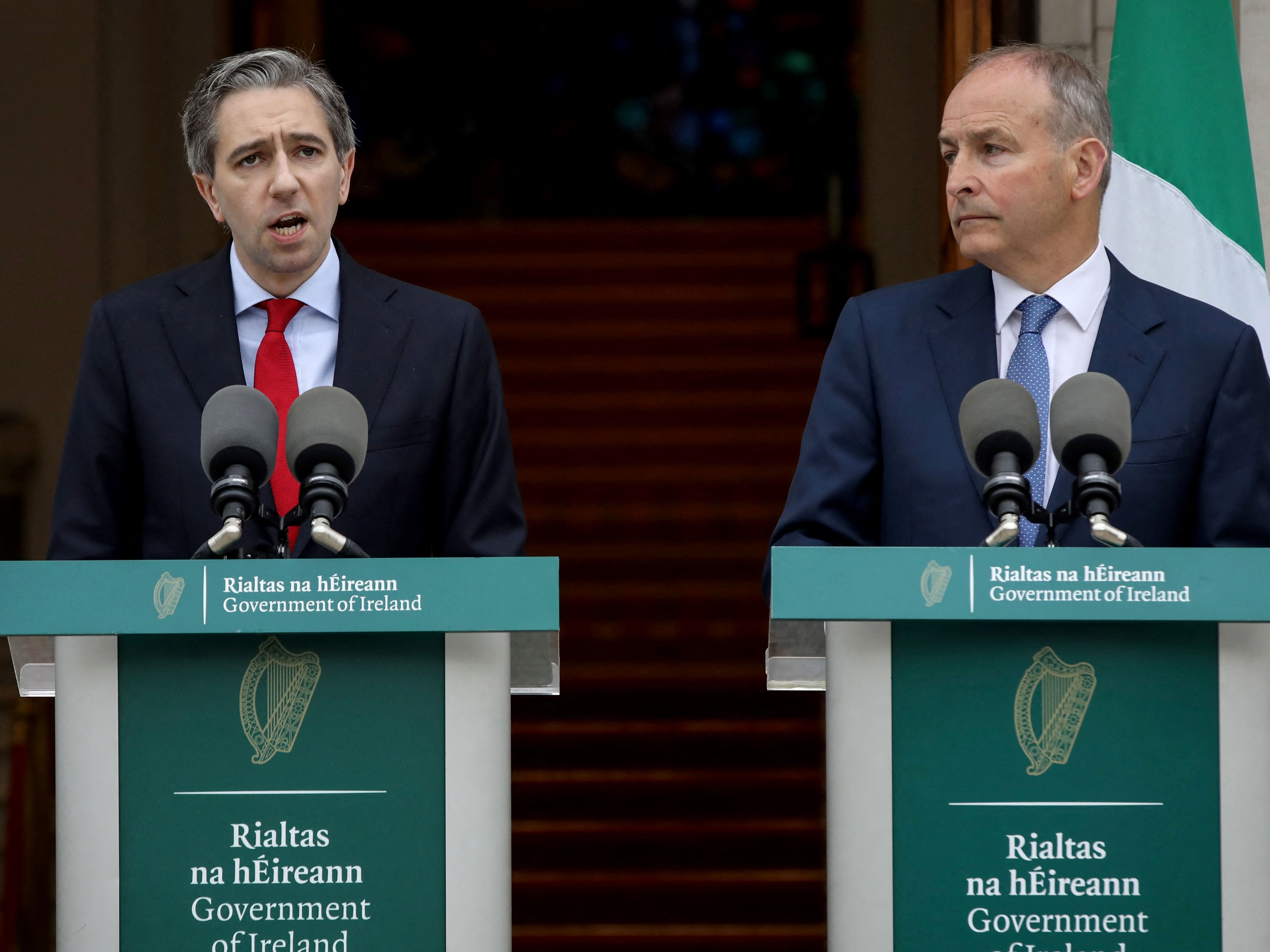 caption: Ireland's Prime Minister Simon Harris, left, flanked by Ireland's Minister of Foreign Affairs Micheál Martin, speaks Wednesday in Dublin to announce Ireland's recognition of a Palestinian state.
