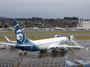caption: A Boeing 737 MAX 9 for Alaska Airlines is pictured along with other aircraft at Renton Municipal Airport adjacent to Boeing's factory in Washington. Alaska Airlines resumed service of its 737 MAX 9 fleet on January 26, 2024, three weeks after an emergency landing prompted sweeping inspections of the aircraft.
