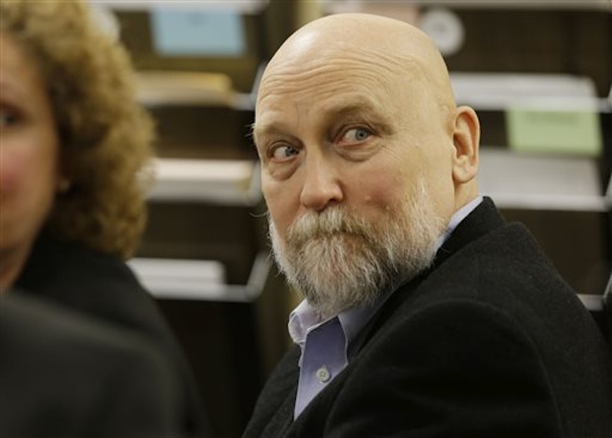 caption: Darold Stenson glances around the courtroom during the first day of testimony in his retrial Sept. 23, 2013, in Port Orchard, Wash.