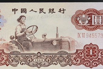 caption: Liang Jun, a tractor driver and Soviet model worker, was immortalized in the 1960s on China's 1 yuan banknote.