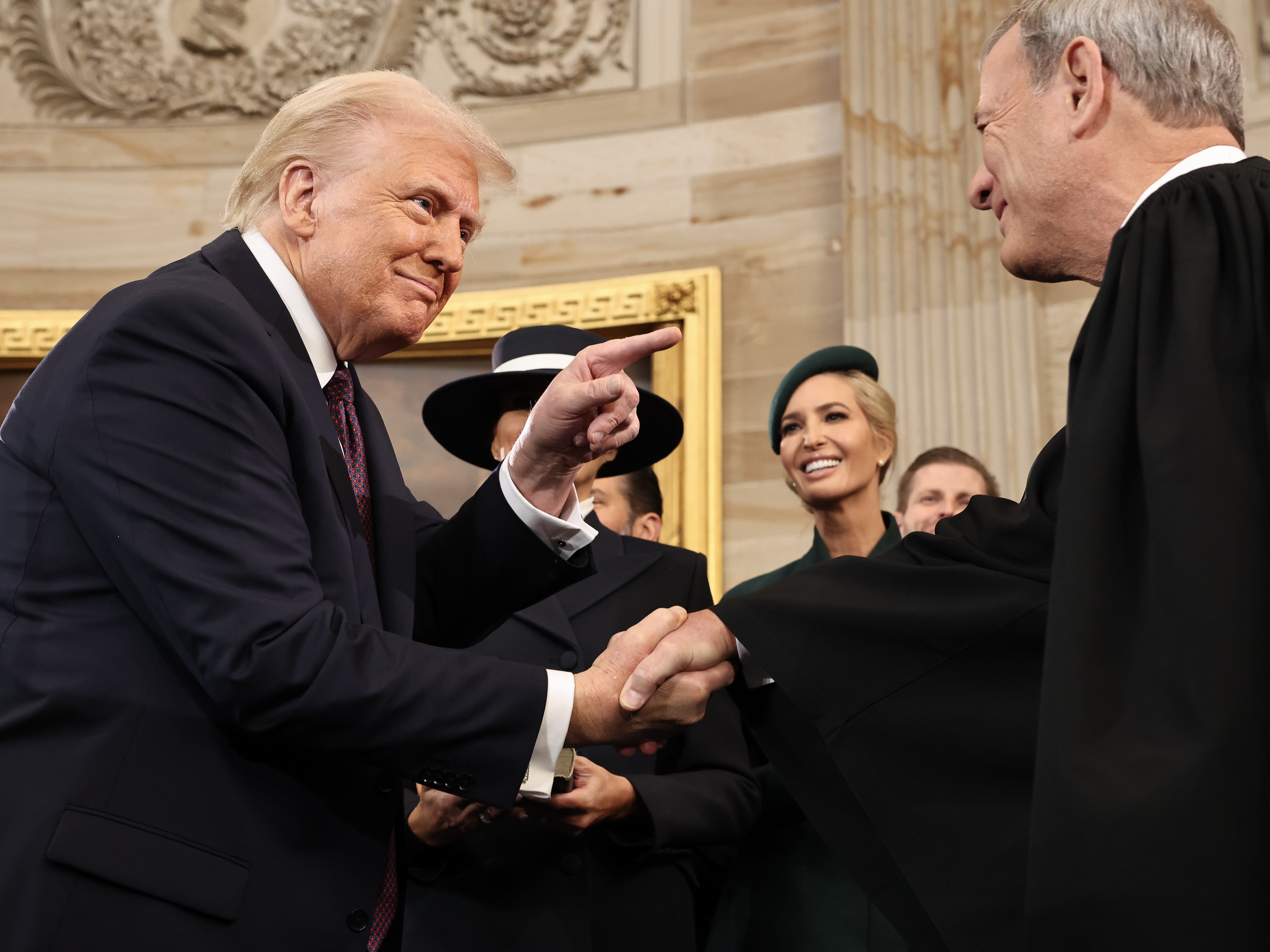 caption: President Donald Trump gestures to U.S. Chief Justice John Roberts after his swearing-in ceremony in the Rotunda of the U.S. Capitol on Jan. 20.