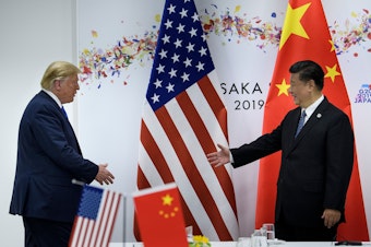 caption: It's unclear whether President Trump and Chinese President Xi Jinping can come to a trade deal. A new bill supporting Hong Kong protesters could complicate talks.