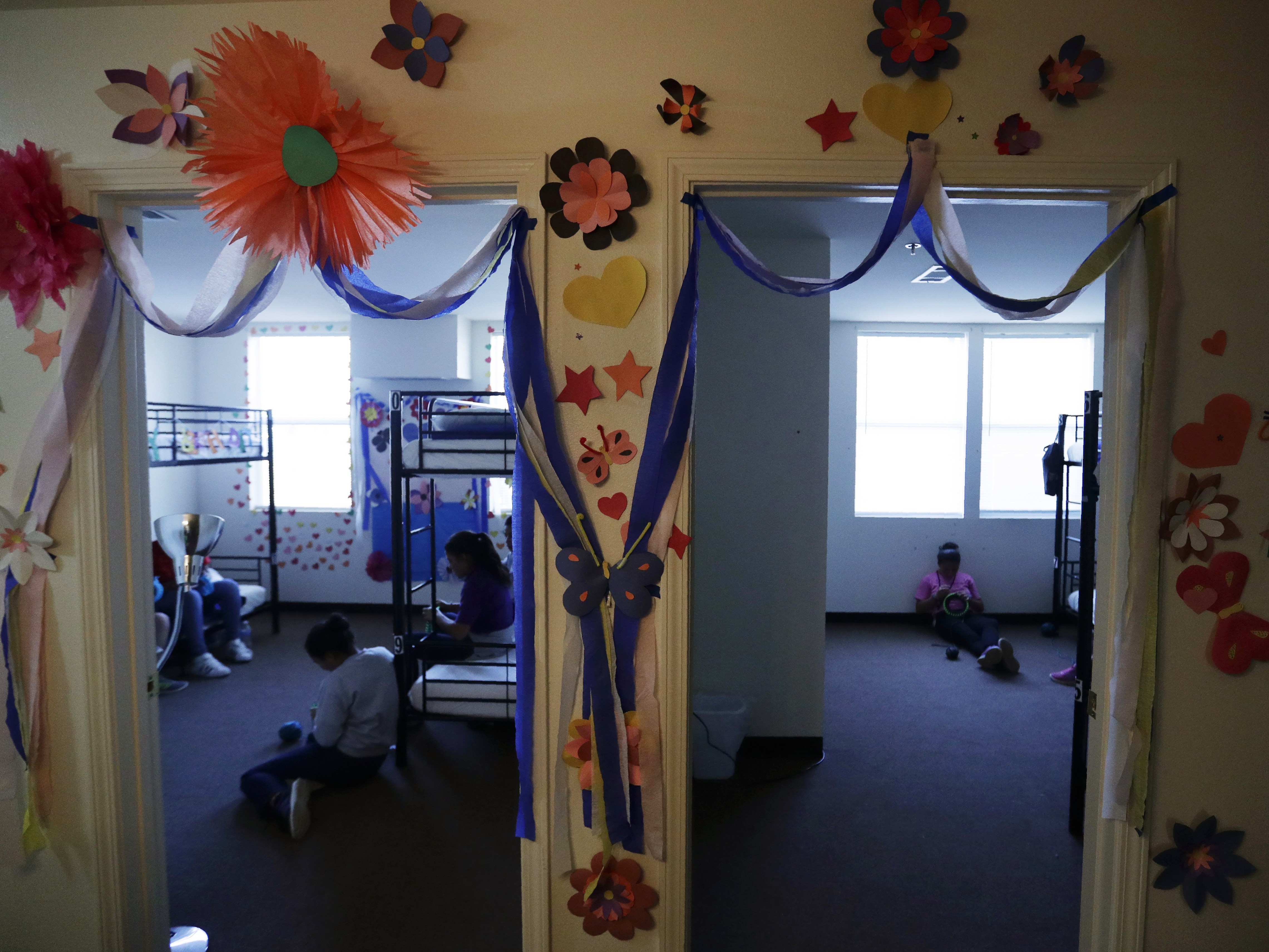 caption: A 2019 photo shows a U.S. government holding center for migrant children in Carrizo Springs, Texas. The facility was reopened by the Biden administration and an independent TV camera is being allowed in to capture new images of conditions there on Wednesday.