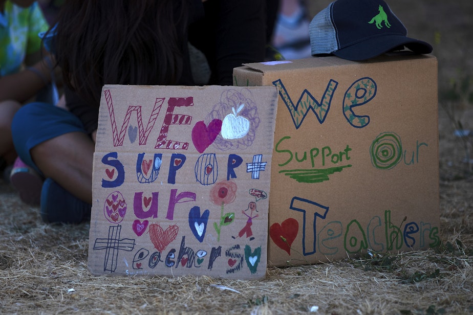 caption: Students show support for their Seattle Public Schools teachers on Tuesday, September 6, 2022, during a rally along 3rd Avenue South in Seattle.