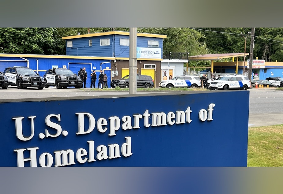 caption: Asylum seekers were called to a federal building on Saturday to check in. Of the 40 who went into the building, about five were detained.