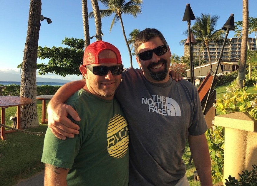 caption: From 11th grade Oak Harbor High School student, Audrey Lang: "This is a picture of my dad and godfather in Hawaii in April of 2017. We took this trip as a way of celebrating the time that he had left of being able to move and walk somewhat freely without assistance. I snapped this picture while both of our families were walking down the sidewalk above the beach towards our dinner reservation that night, and my dad and him looked so happy it was the perfect opportunity for a picture."