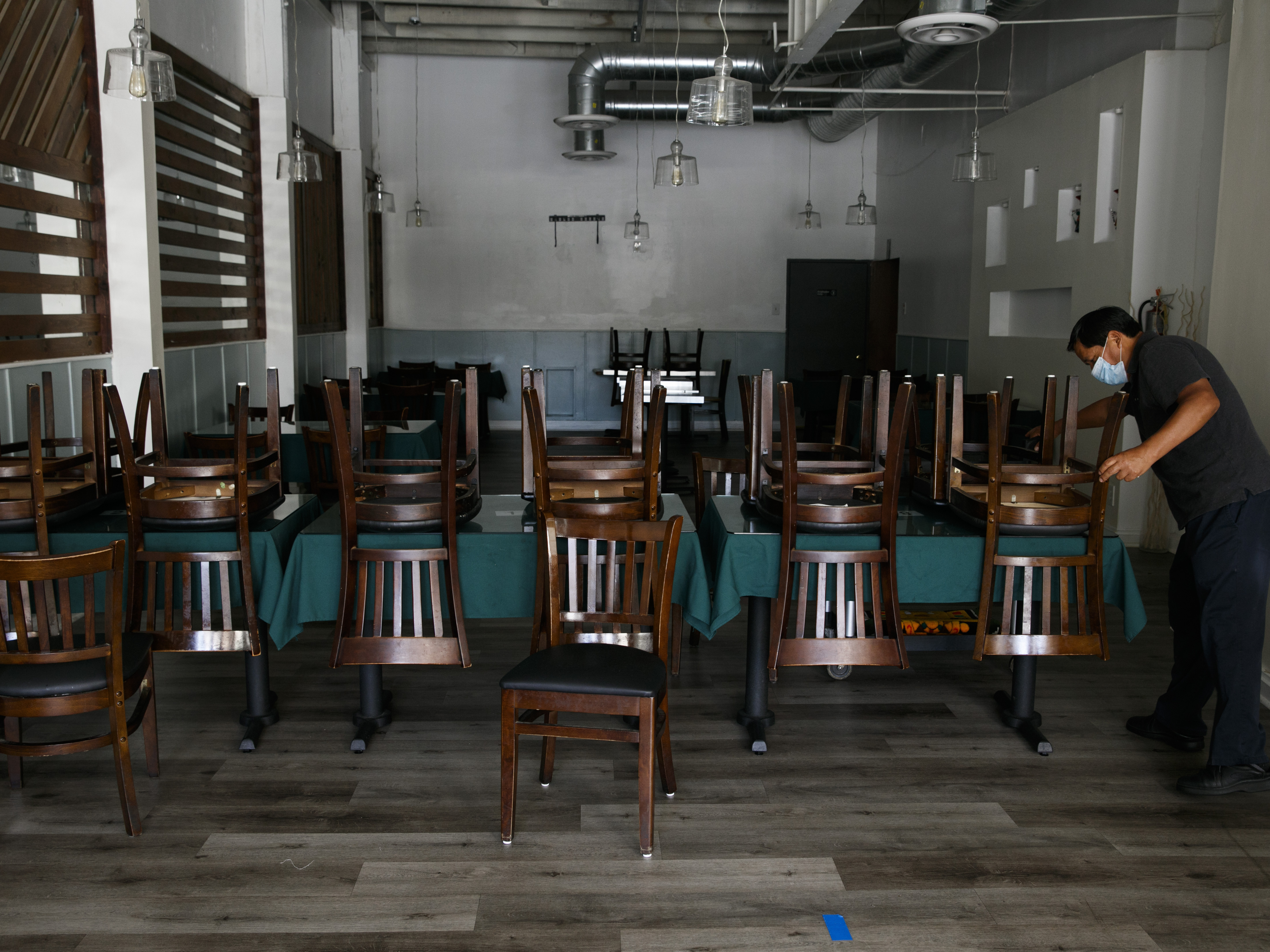 caption: California restaurants such as Fabian Nahui's Peruvian establishment in Los Angeles must close their indoor operations. Gov. Gavin Newsom reimposed the restrictions on indoor businesses, citing an increase in COVID-19 cases and hospitalizations in the state.