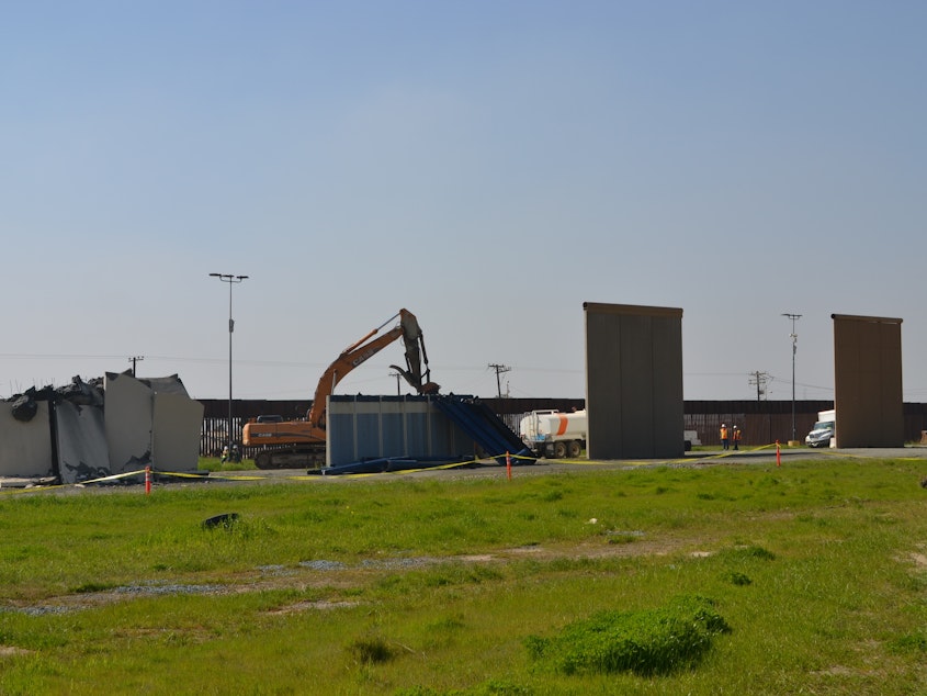 caption: In 2017 the Trump Administration put up eight border wall prototypes to demonstrate the "next generation" of border barriers. On Wednesday, all but one were demolished.