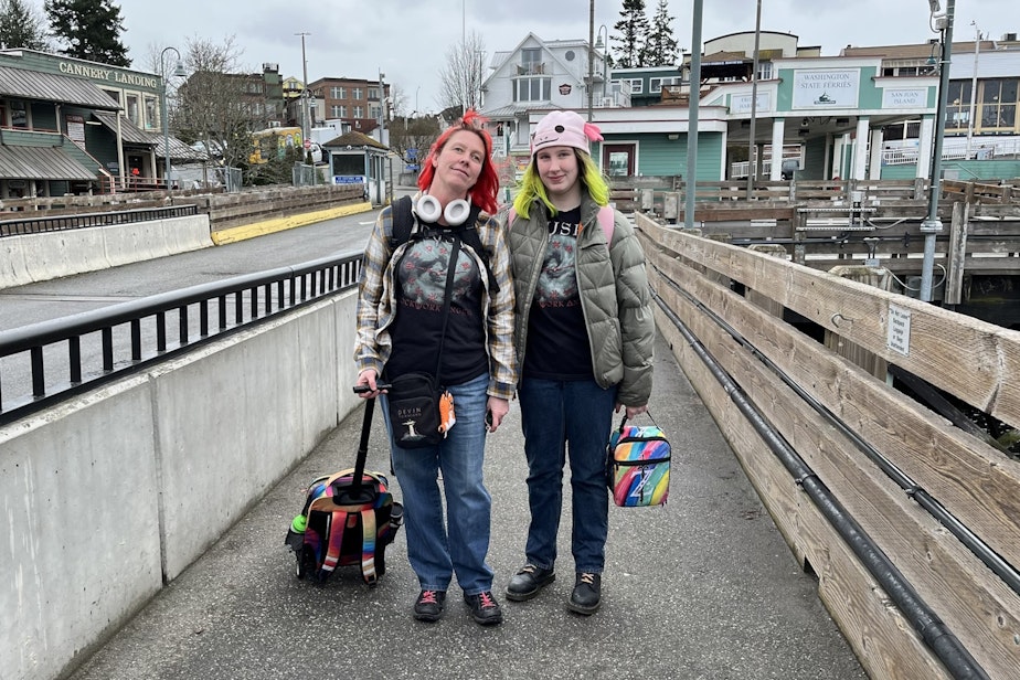 caption: Mother and daughter Tenar Hall (left) and Cathy Hall (right) wait to board the ferry home from Friday Harbor, where Tenar teaches and Cathy attends Spring Street International School. They're dressed alike for the school's "twin day.”
