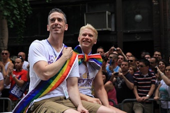 caption: Dan Savage and husband Terry Miller are seen in a 2011 photo.
