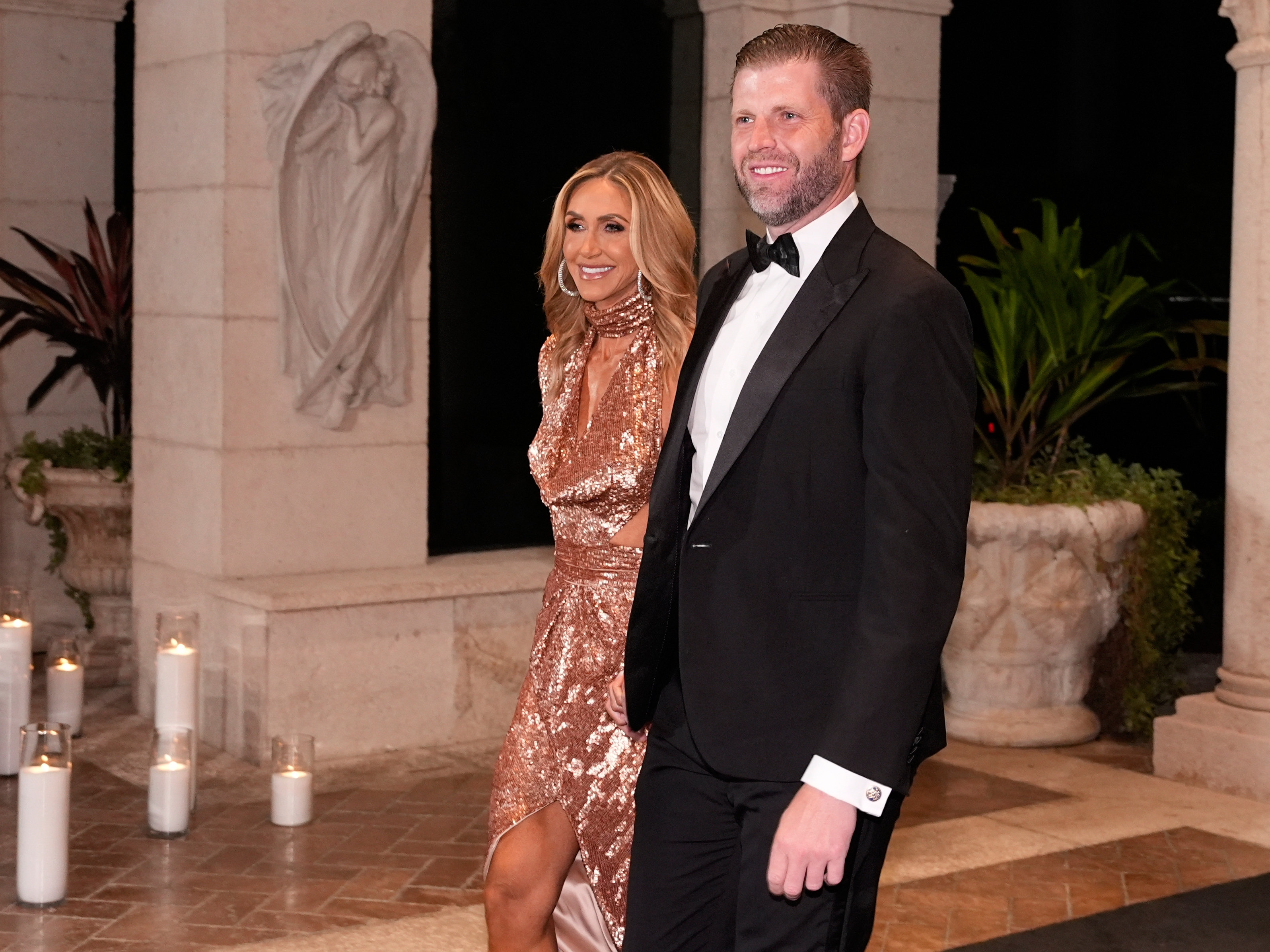 caption: Eric Trump and Lara Trump arrive before President Donald Trump and first lady Melania Trump for a New Year's Eve celebration at his Mar-a-Lago club, Wednesday, Dec. 31, 2025, in Palm Beach, Fla.