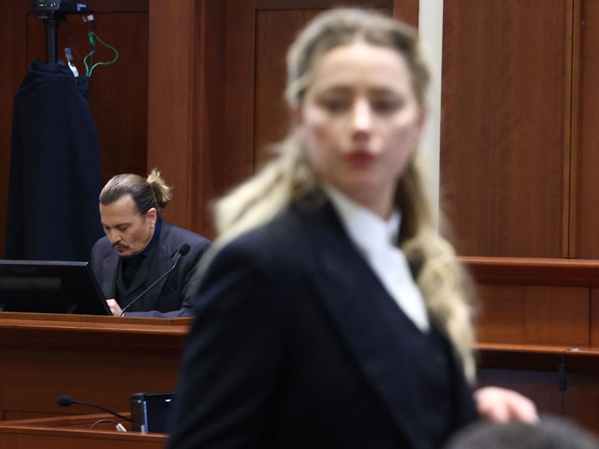 caption: Amber Heard has filed a countersuit against Johnny Depp, seeking $100 million in damages and saying his legal team falsely accused her of fabricating claims against Depp. The former couple are seen here in court last week.