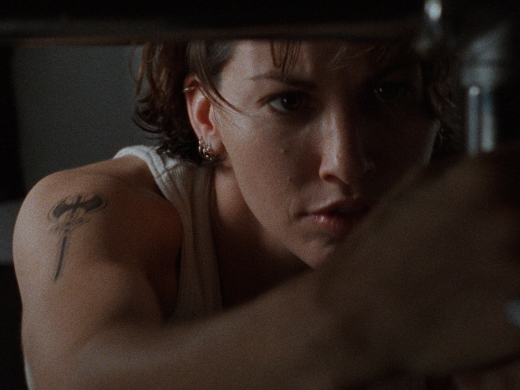 caption: Gina Gershon as Corky in <em>Bound</em>. The Wachowskis have said that casting Corky and her love interest Violet was challenging, and some studios even advised that Corky's character be re-written as a man. 