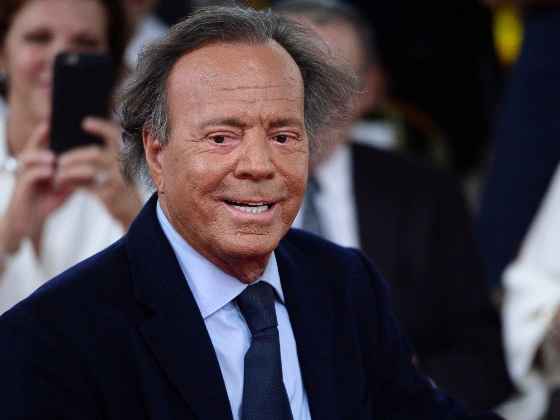 caption: Spanish singer Julio Iglesias smiles during his star unveiling ceremony at the Walk of Fame in San Juan, Puerto Rico, Thursday, Sept. 29, 2016.