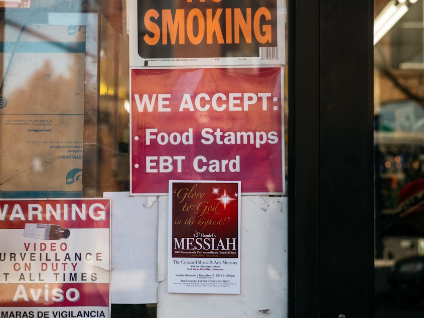 caption: A federal judge has tossed out a controversial USDA rule that would have limited food stamps, noting that during the pandemic, "SNAP rosters have grown by over 17 percent with over 6 million new enrollees." Here, a sign alerts customers about SNAP food stamp benefits at a Brooklyn store in New York City.