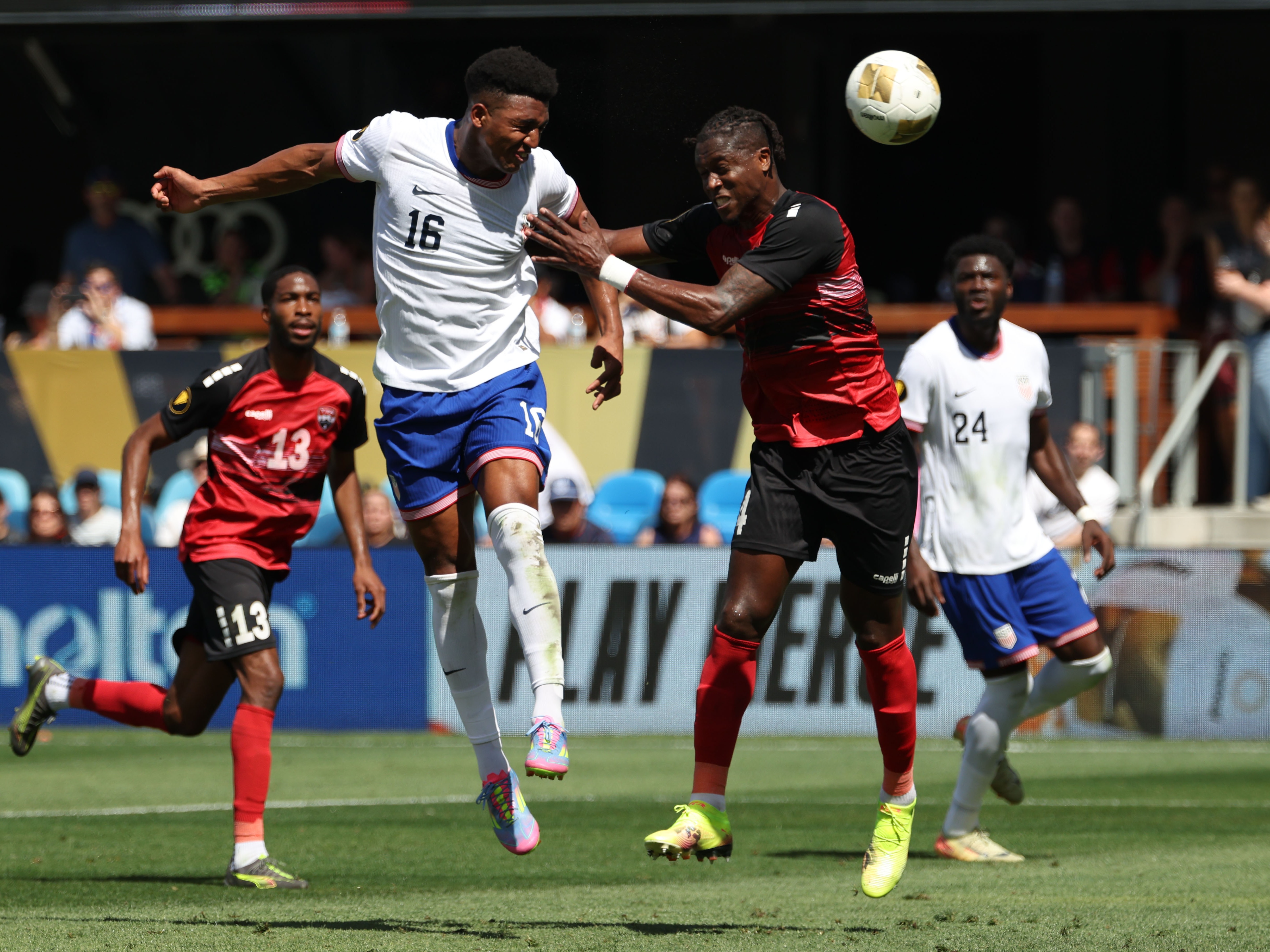 caption: Alexander Freeman #16 of the United States battles Sheldon Bateau #4 of Trinidad and Tobago during the Gold Cup 2025 on Sunday in San Jose, Calif. The U.S. defeated Trinidad and Tobago to snap a four-game losing streak as it eyes next year's World Cup, which the U.S. is co-hosting.