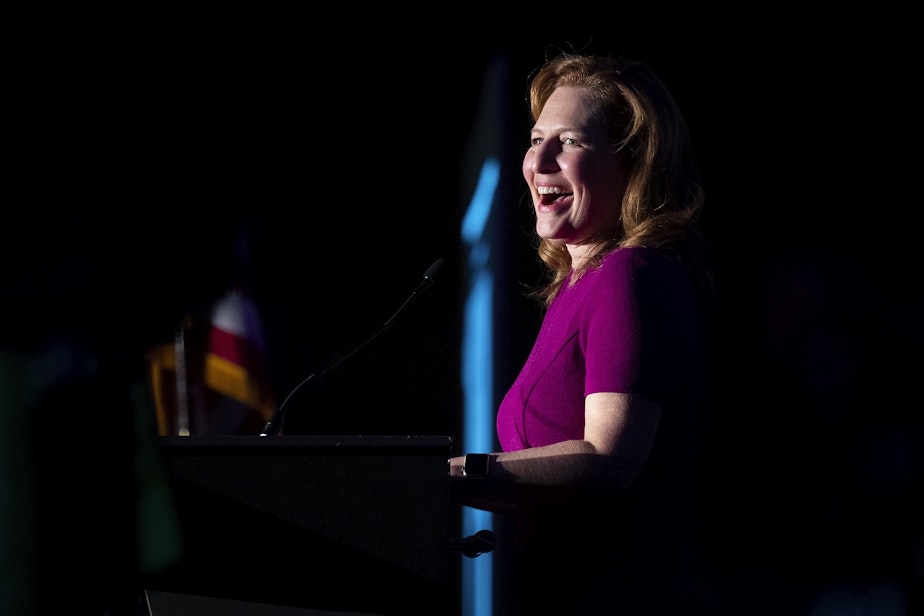caption: Congresswoman Kim Schrier smiles while speaking to supporters during an election night party on Tuesday, November 8, 2022, at the Westin in Bellevue.  
