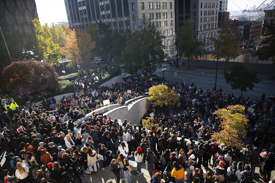 caption: Thousands of students rallied on the steps of Seattle city hall after walking out of class in protest of gun violence in schools on Monday, Nov. 14, 2022, in Seattle.