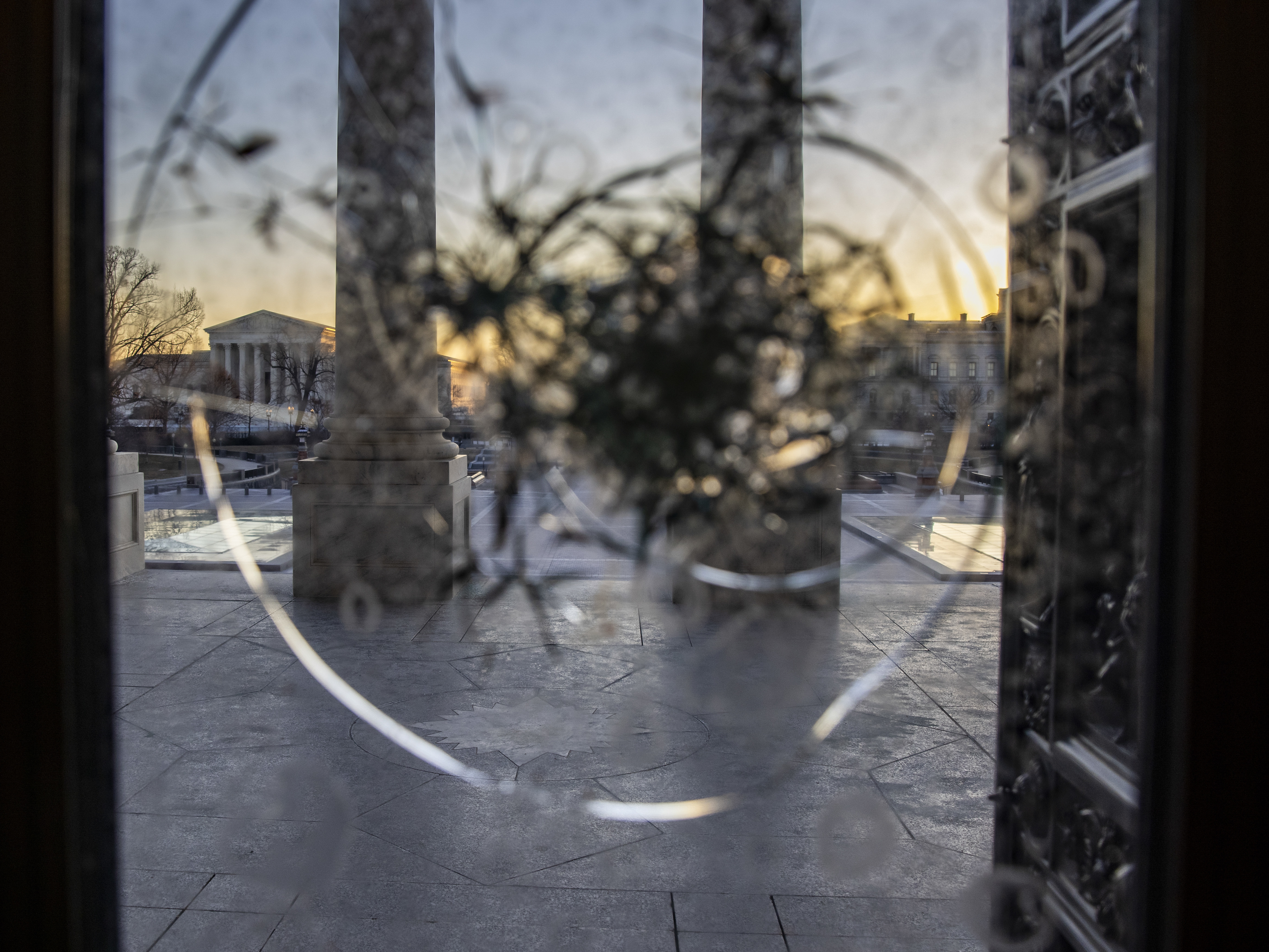 caption: The U.S. Capitol is seen as National Guard secure the the grounds on Monday.