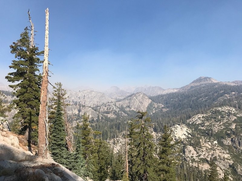 caption: Smoke from the Lions Fire obscures granite peaks in the Sierra Nevada. CREDIT: NATHAN ROTT