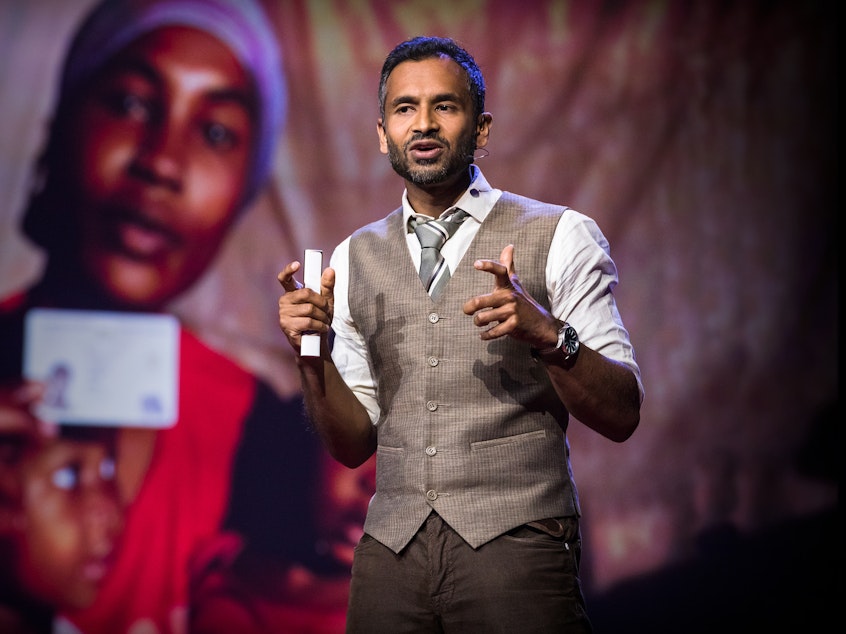 caption: Vivek Maru on the TED stage.