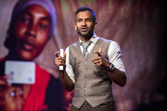 caption: Vivek Maru on the TED stage.