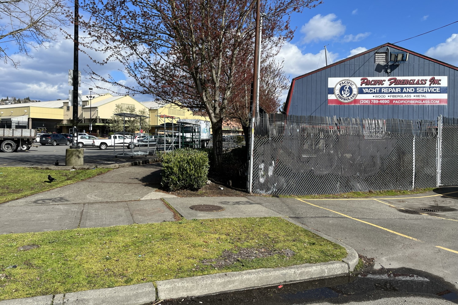 caption: Fred Meyer in Ballard - seen in the deistance next to a Yacht Repair business.