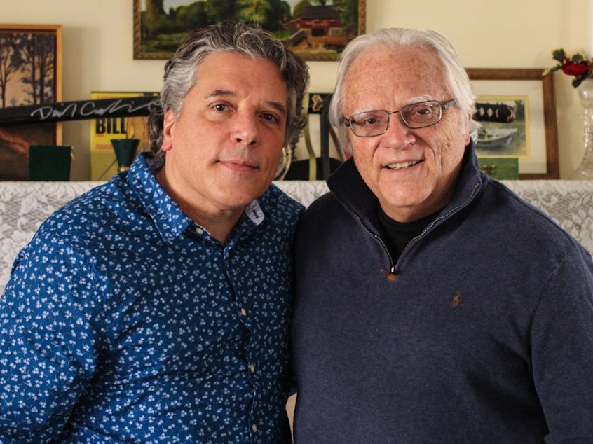 caption: Tom J. Germano (right) told his son, Thomas Germano, about when he took part in the Great Postal Strike of 1970 to demand better pay, during a visit to StoryCorps last month in North Babylon, N.Y.