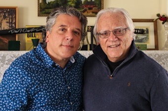 caption: Tom J. Germano (right) told his son, Thomas Germano, about when he took part in the Great Postal Strike of 1970 to demand better pay, during a visit to StoryCorps last month in North Babylon, N.Y.
