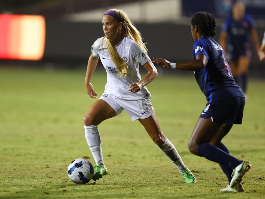 caption: Mikayla Cluff (left) of the Orlando Pride defends Naomi Girma of the San Diego Wave FC during an Aug. 13, 2022, game in San Diego, Calif. The Pride's uniforms will be looking different this season after the team ditched players' white shorts.