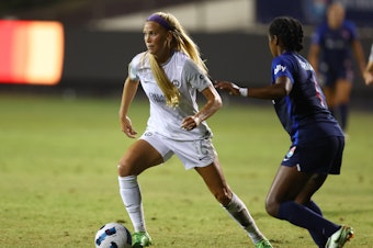 caption: Mikayla Cluff (left) of the Orlando Pride defends Naomi Girma of the San Diego Wave FC during an Aug. 13, 2022, game in San Diego, Calif. The Pride's uniforms will be looking different this season after the team ditched players' white shorts.