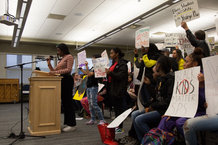 caption: Erica Ijeoma, 17-year-old senior at West Seattle High School, speaks during the public comment portion of the Seattle School board meeting. She was adamantly against the district placing ethnic studies program manager Tracy Castro-Gill on administrative leave. 